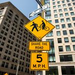 Signs alerting pedestrians, cyclists, and drivers to the new street rules near Broadway and West 24th Street.</br>